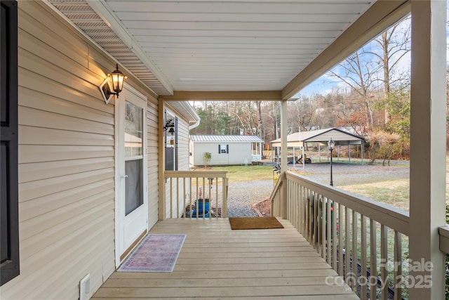 wooden deck with a carport