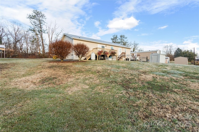 exterior space featuring a yard and a shed