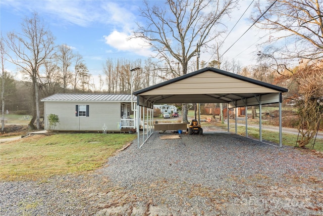 view of parking with a carport and a lawn