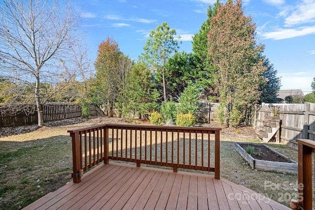 wooden deck with a yard