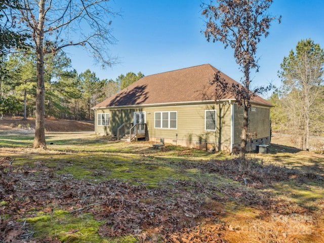 back of property featuring cooling unit