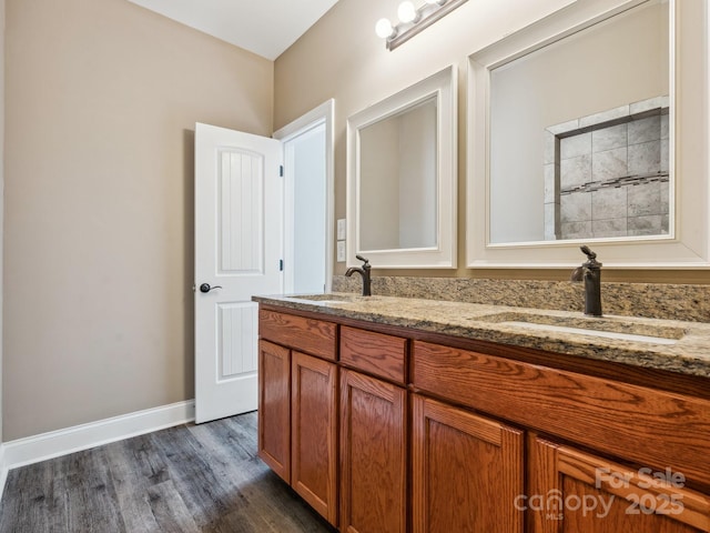 bathroom featuring hardwood / wood-style floors and vanity