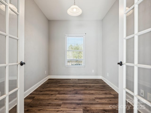 empty room with dark wood-type flooring