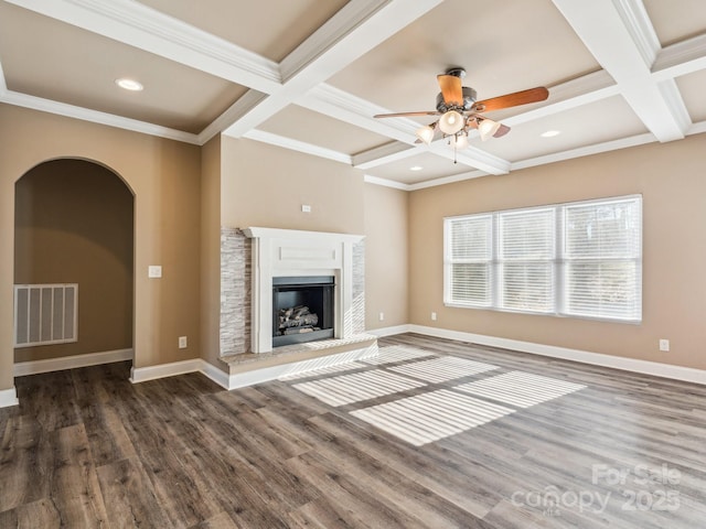 unfurnished living room with beamed ceiling, dark hardwood / wood-style flooring, ornamental molding, and coffered ceiling