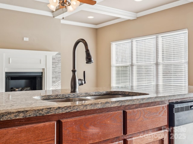 interior space featuring coffered ceiling, ceiling fan, crown molding, sink, and beam ceiling