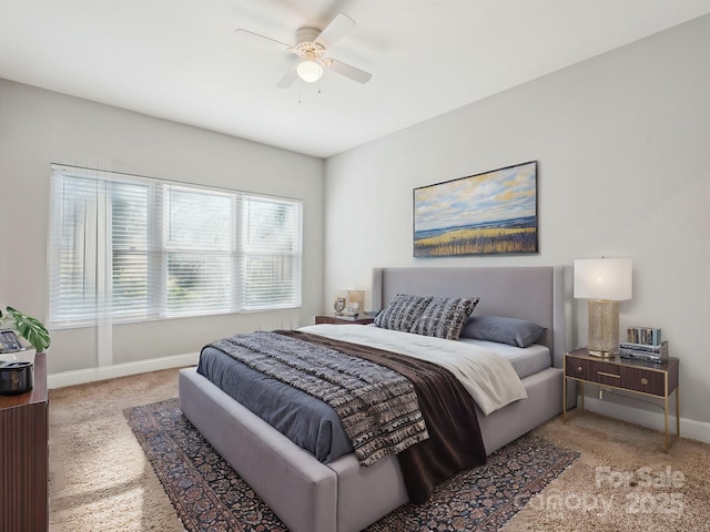 bedroom featuring ceiling fan and light colored carpet