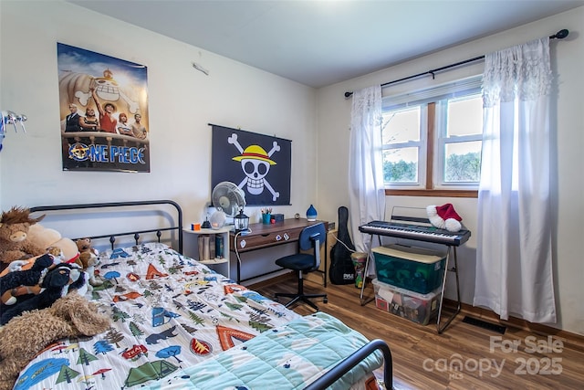 bedroom featuring wood-type flooring