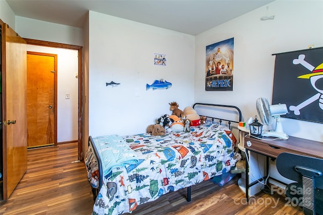 bedroom featuring dark wood-type flooring