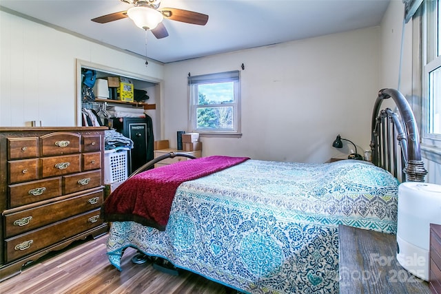 bedroom featuring ceiling fan and wood-type flooring