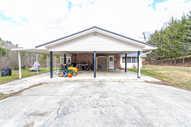 view of front of property with a front yard and a carport