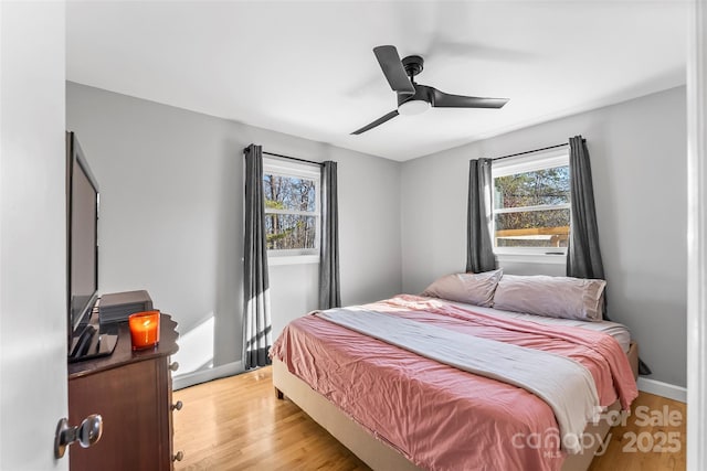 bedroom featuring ceiling fan and light hardwood / wood-style flooring