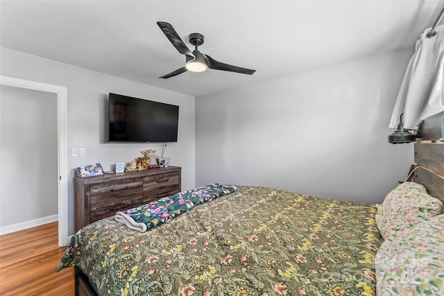 bedroom featuring hardwood / wood-style flooring and ceiling fan