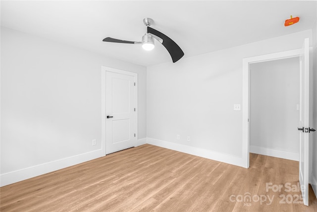 unfurnished room with ceiling fan and light hardwood / wood-style floors