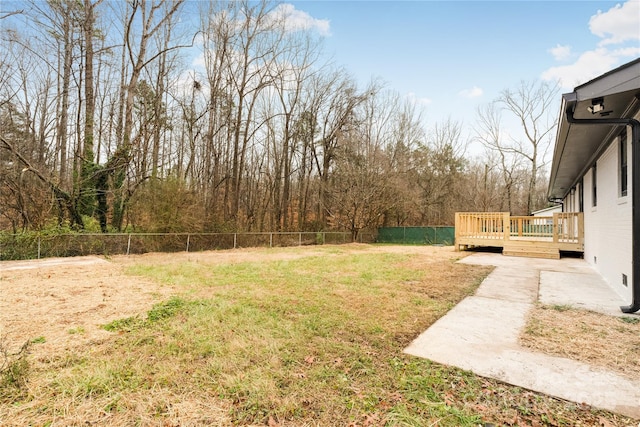 view of yard featuring a wooden deck