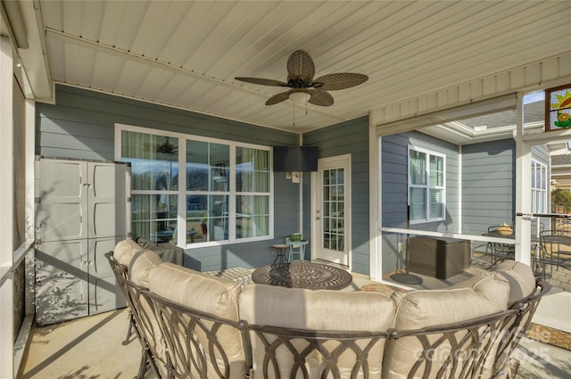 view of patio / terrace with an outdoor living space and ceiling fan