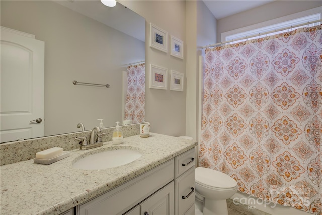 bathroom with vanity and toilet