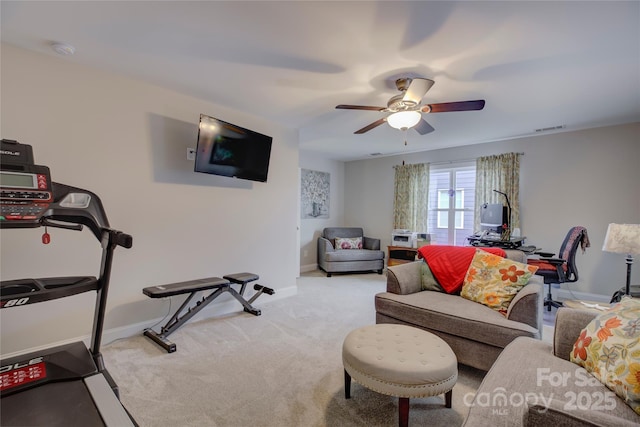 interior space with ceiling fan and light carpet