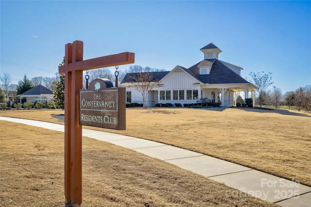 view of property's community with a yard