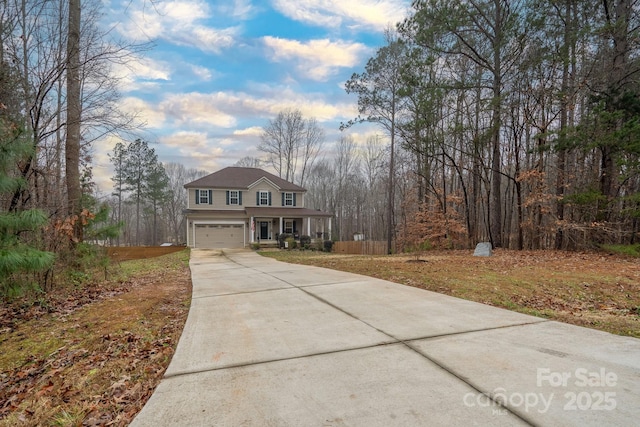 front facade with a garage and a front lawn