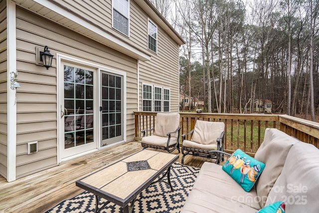 wooden terrace with outdoor lounge area