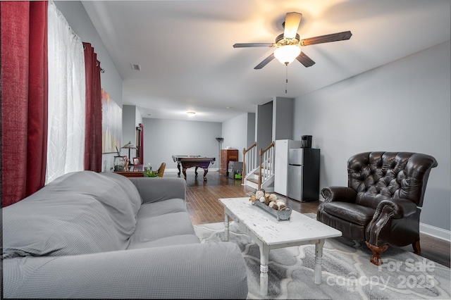 living room with ceiling fan, hardwood / wood-style flooring, and billiards