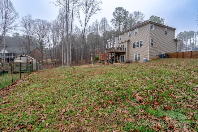 view of yard featuring an outdoor structure and a wooden deck