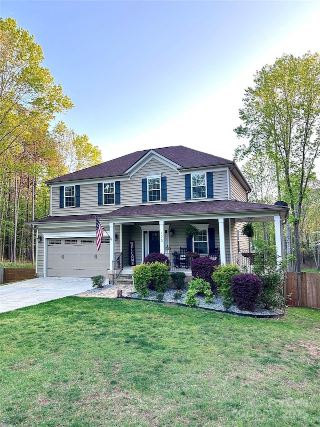 123 Kingfisher Dr, Mooresville, NC 28117 - view of front facade featuring a porch, an attached garage, driveway, and a front yard