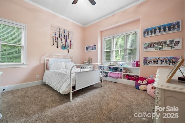 bedroom featuring carpet, ceiling fan, and crown molding