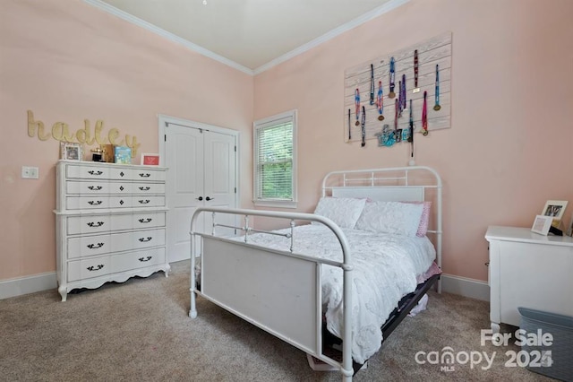 carpeted bedroom featuring a closet and crown molding