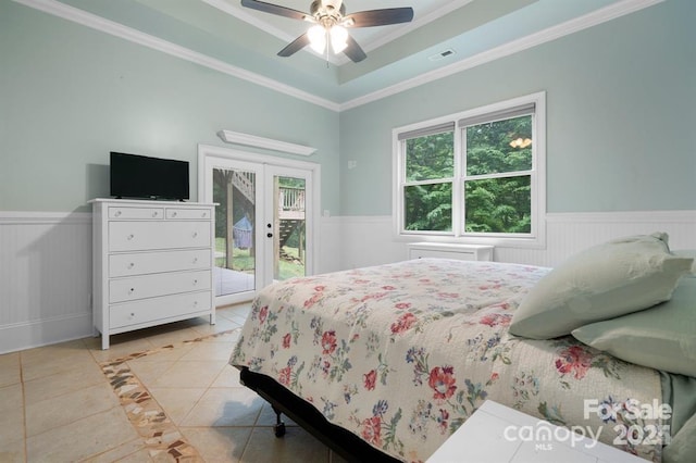 bedroom featuring ceiling fan, light tile patterned floors, access to outside, and multiple windows