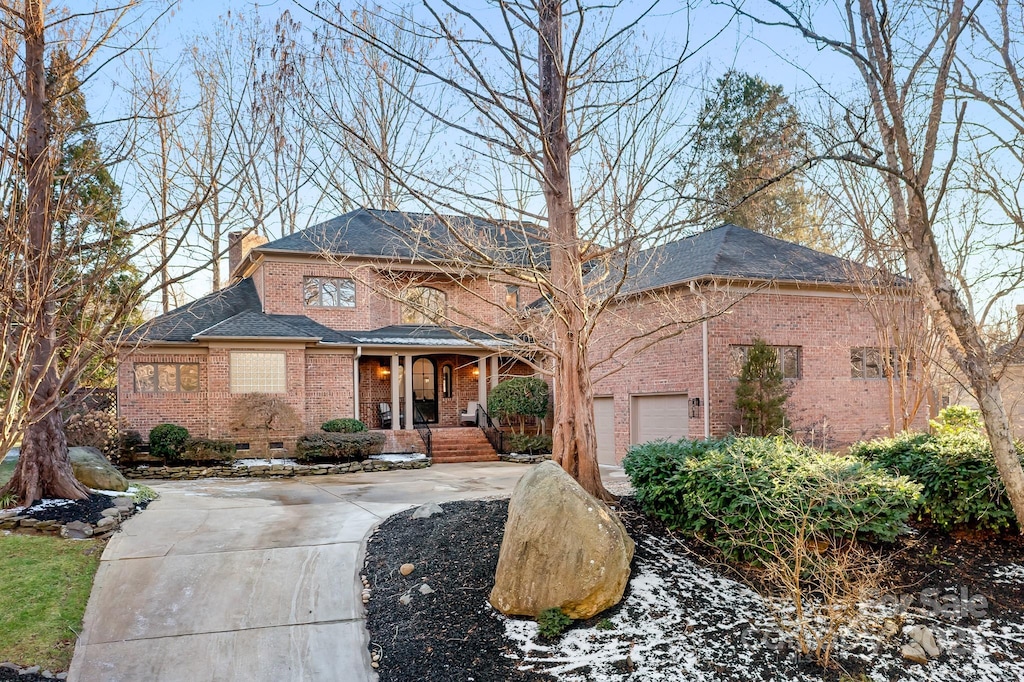 view of front of home featuring covered porch and a garage