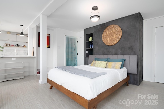 bedroom featuring wood finished floors