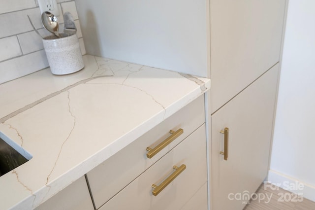 interior details featuring light stone countertops