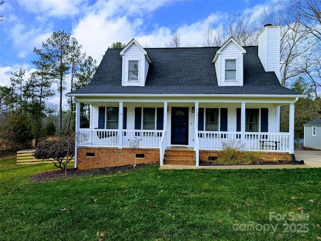 view of front of house with a porch and a front yard