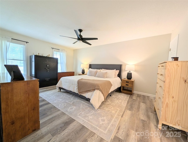 bedroom featuring hardwood / wood-style floors and ceiling fan