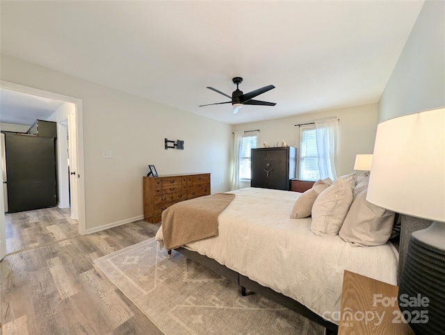 bedroom featuring ceiling fan and light hardwood / wood-style floors