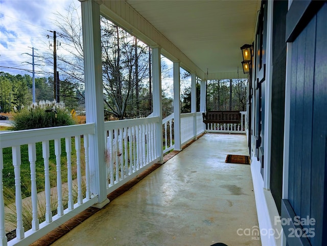 balcony featuring covered porch