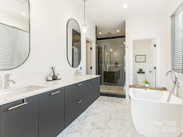 bathroom featuring plus walk in shower and vanity