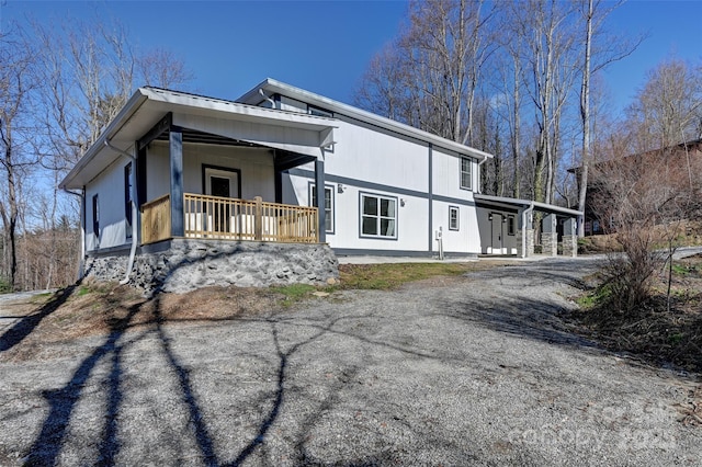 view of property exterior with a porch