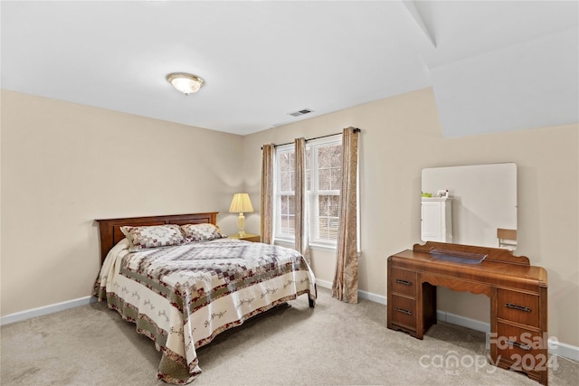 bedroom featuring light colored carpet