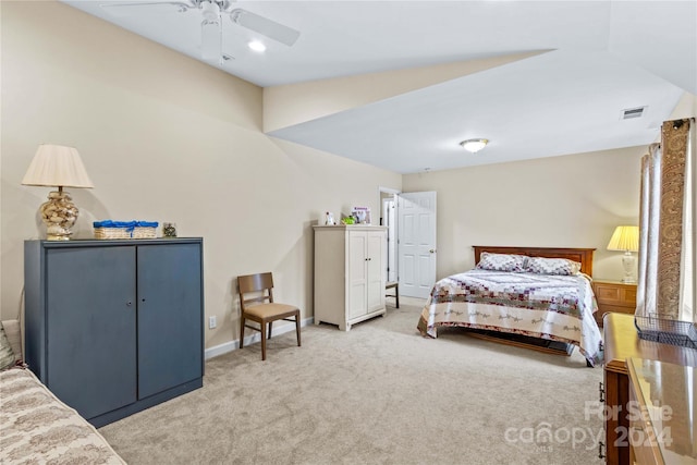 carpeted bedroom with ceiling fan and lofted ceiling