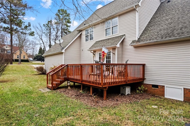 back of property featuring a yard and a wooden deck