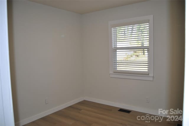 empty room featuring hardwood / wood-style flooring