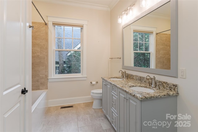 full bath featuring a sink, ornamental molding, baseboards, and visible vents