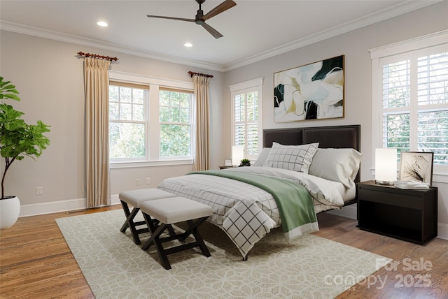 bedroom with light wood-type flooring, recessed lighting, baseboards, and crown molding