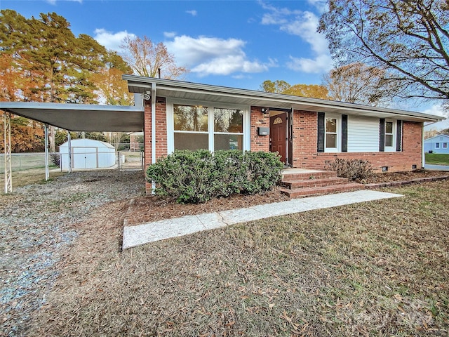 view of front of property with a carport