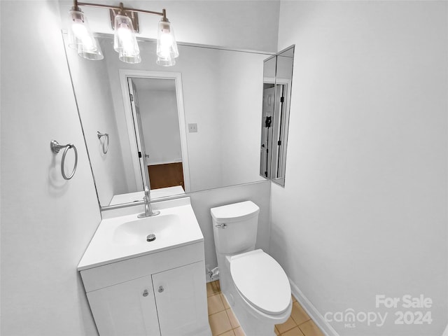 bathroom with tile patterned floors, vanity, and toilet