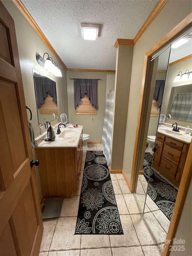 bathroom featuring ornamental molding, toilet, and vanity