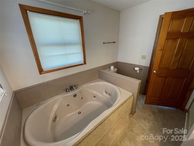 bathroom with tiled tub