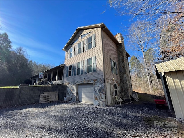 view of side of home with a garage